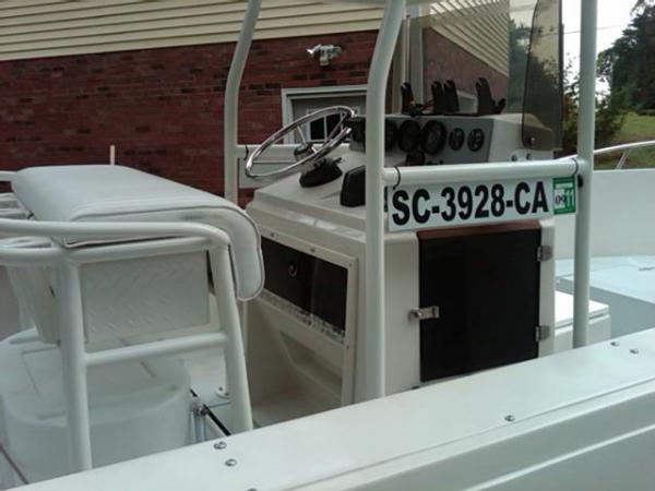 Registration plate I saw on a boat in a magazine, made out of white aluminum plate and hung it, I like that better not having any stickers when I wax or buff