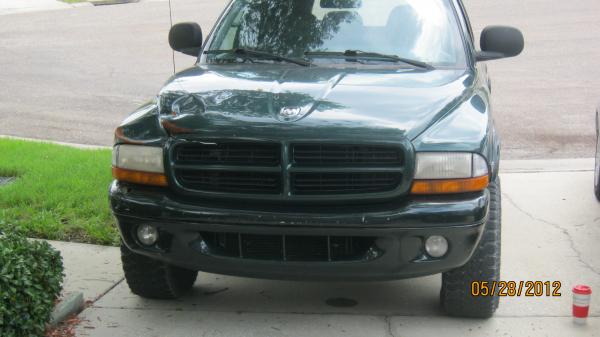 an 1999 Dodge Durango from Maine (rust) to pull it, front end damage, no heat and ac, two windows not working, rear hatch wont stay up and in need of a major tune-up,