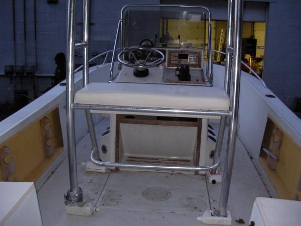 I'll tie that post/top to the stringers w/aluminum brackets. I can get to the stringers through the tank cover. I just recored it and have yet to 5200 it down.