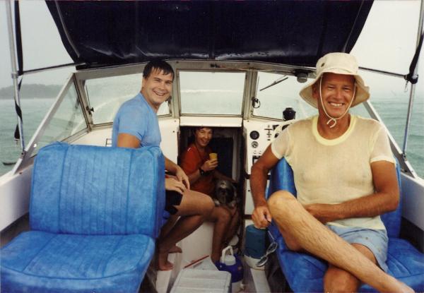 This picture is from the early 90's - waiting out a storm.  Between the seats has a well area and storage under the bow.  New seats were installed in 2009 - light gray.